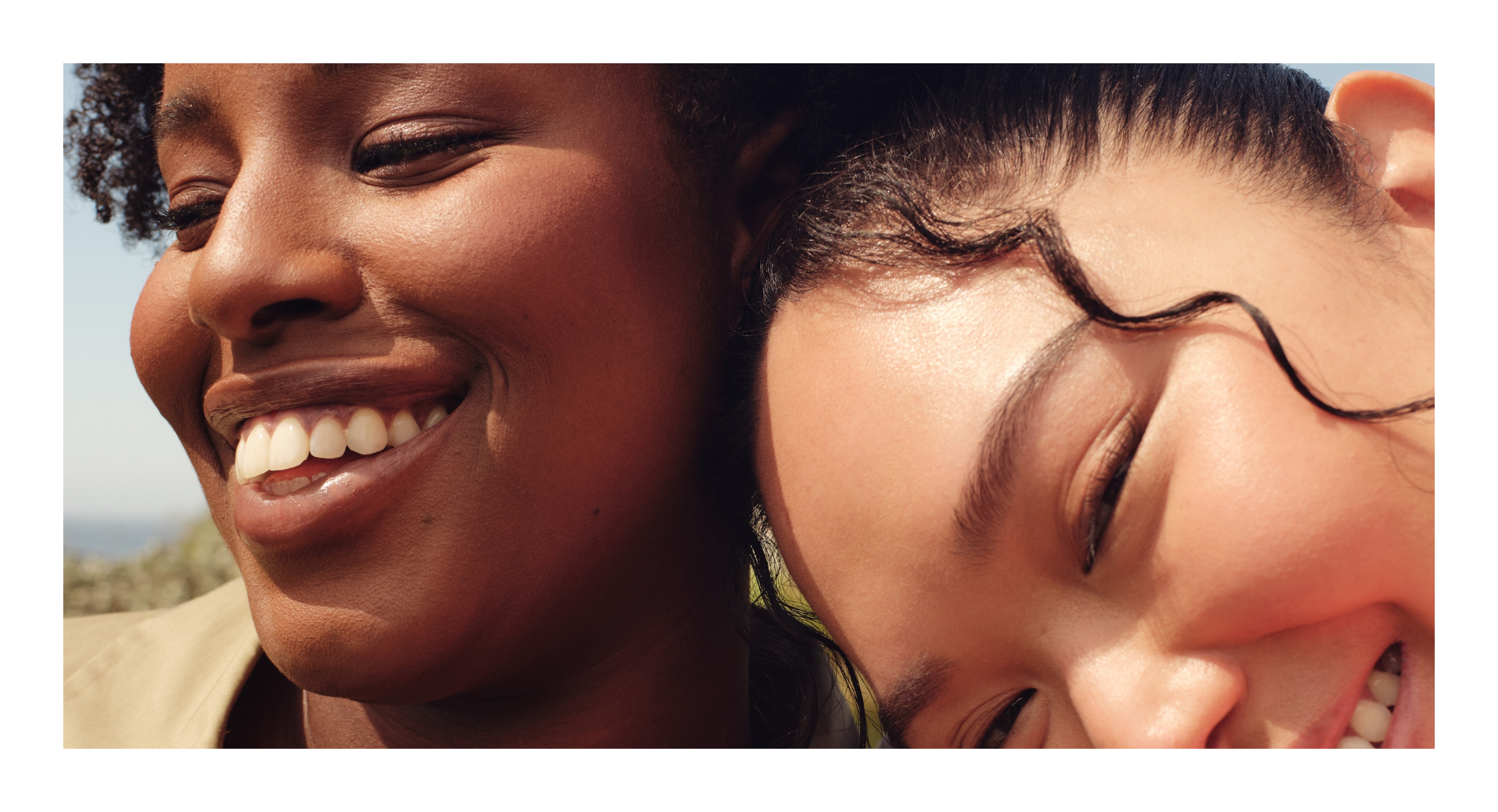 blurry photo of sunset over ocean with logo on top